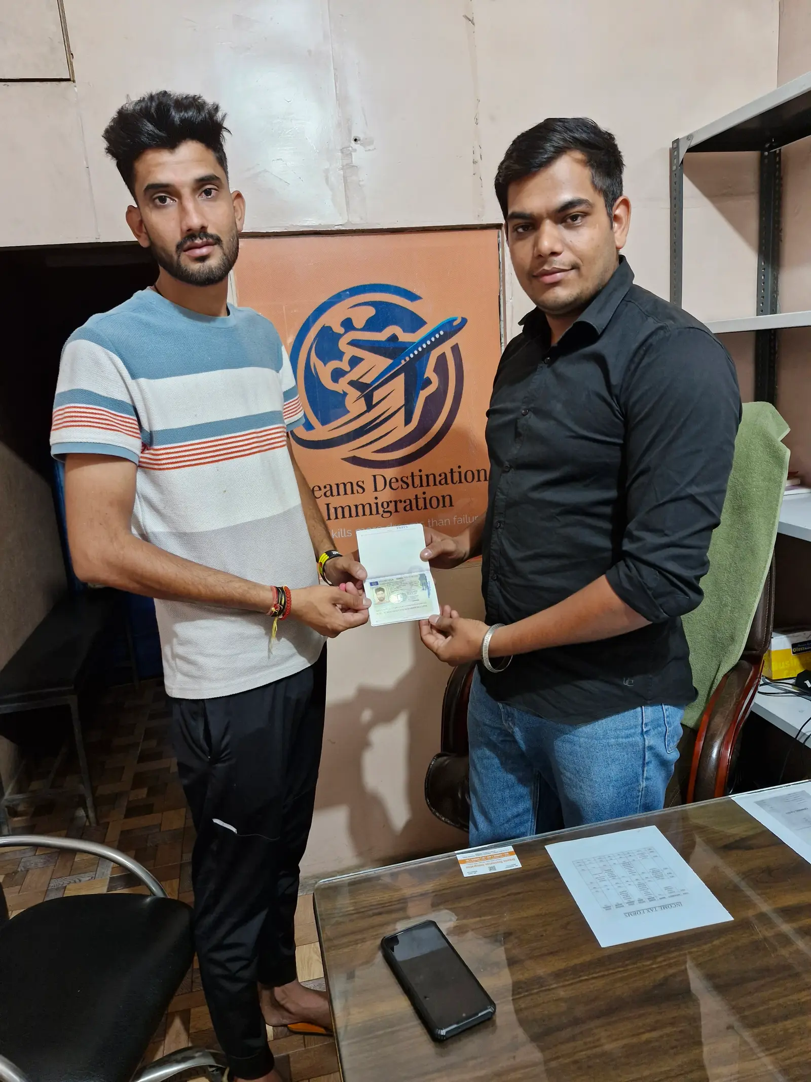 Client receiving stamped passport at Dreams Destination Hisar